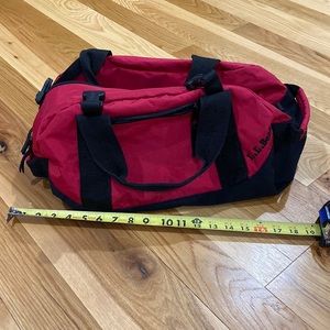 L.L. Bean red and black duffel bag with no shoulder strap